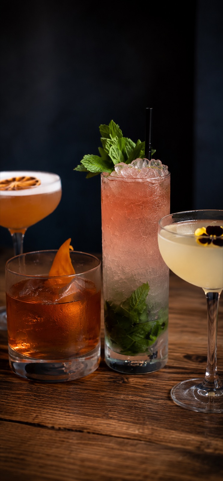Bartender pouring craft cocktails